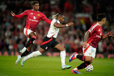 Manchester United Vs Fulham: Manchester United's Marcus Rashford, left, challenges Fulham's Adama Traore